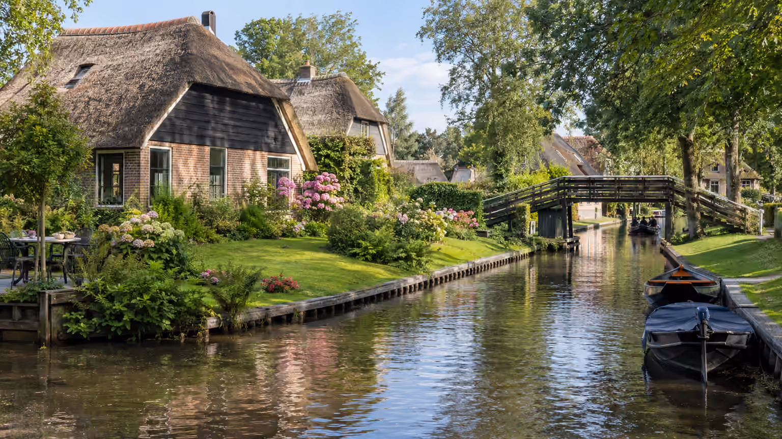Giethoorn Netherlands canal with traditional thatched cottages