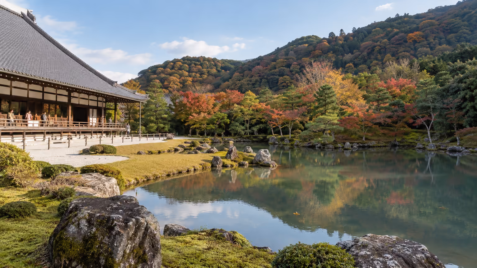 Tenryuji's pond garden in Kyoto Japan with mossy rocks
