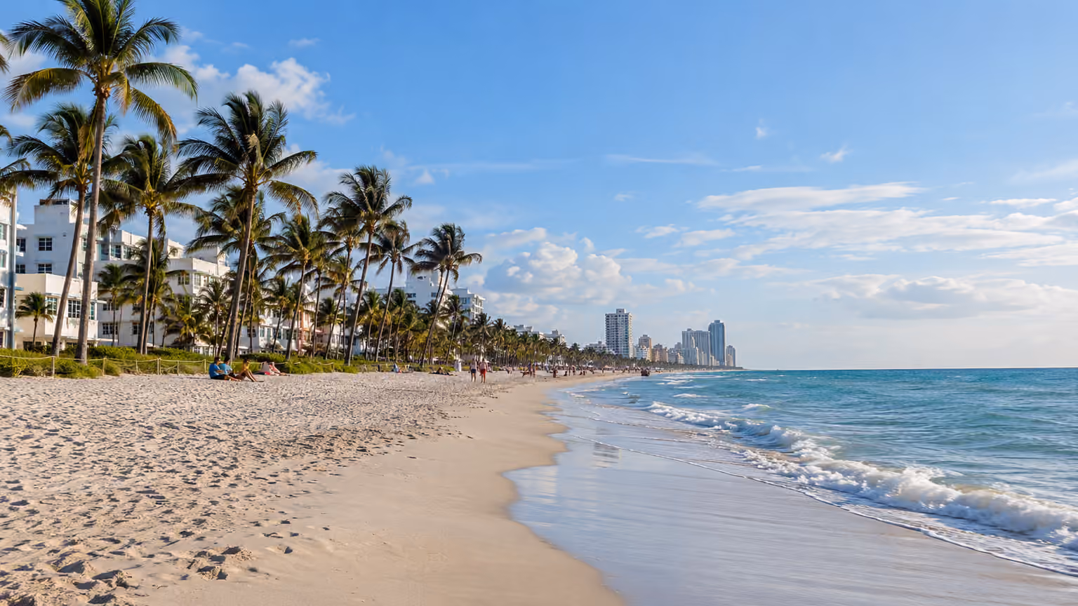 South Beach Miami's wide sandy shore and oceanfront palms with gentle Atlantic surf