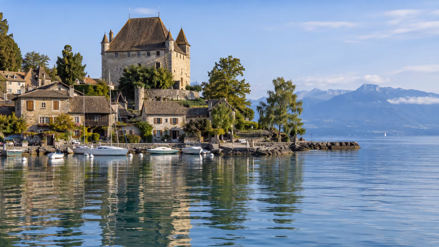 Yvoire’s castle and harbour on the shore of Lake Geneva