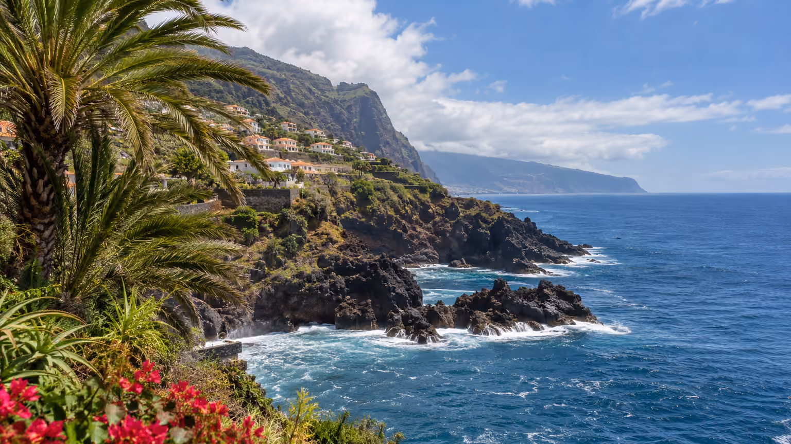 A close natural view of Atlantic water meeting volcanic cliffs near Madeira's south coast
