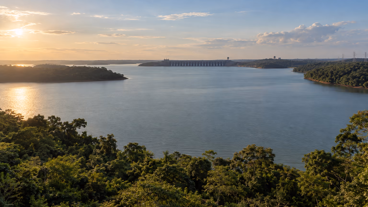 Broad reservoir water bordered by forest near Itaipu, where Guaíra Falls once flowed